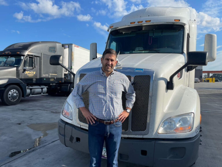 Scotty Edward Chabert Jr in-front of an 18-wheeler, for the blog post "How Long Does an 18-Wheeler Lawsuit Take?".