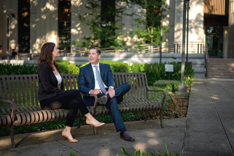 Understanding Prescription for Personal Injury Claims - An image of two Saunders and Chabert lawyers sitting on a park bench.
